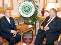 Iranian Foreign Minister Manuchehr Mottaki (left) with Iraqi President Jalal Talabani in Riyadh on March 28 (epa)