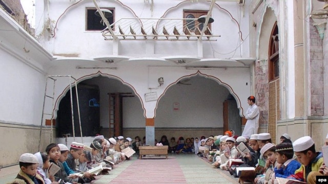 Madrasah students study at a mosque in Peshawar, Pakistan.