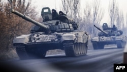 A column of tanks is photographed driving in rebel-held territory near Donetsk in eastern Ukraine.