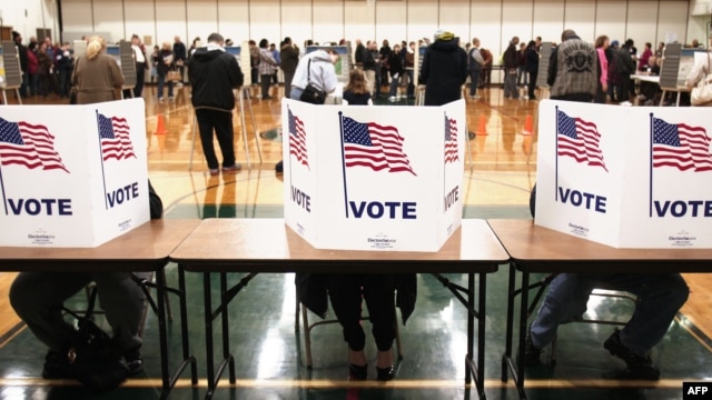 U.S. citizens vote in the presidential election at Carleton Middle School in Sterling Heights, Michigan.