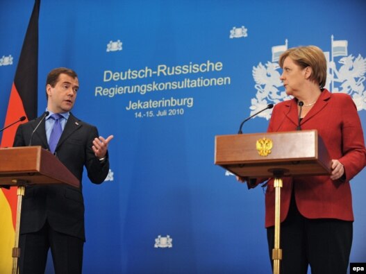 Russian President Dmitry Medvedev and German Chancellor Angela Merkel give a press conference after the plenary session of the German-Russian government talks in Yekaterinburg on July 15.