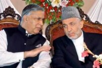 Aziz (left) with Karzai in September 2006 (AFP)