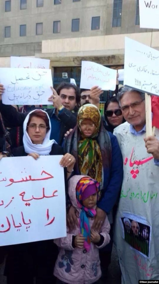 Leading Iranian rights activists Nasrin Sotoudeh (far left) and Mohammad Nourizad (far right) attend a rally in Tehran to protest recent spate of acid attacks on women.