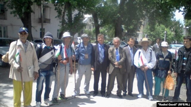 The men, along with other locals, posed for a group picture before they set off from Kulob, Tajikistan.