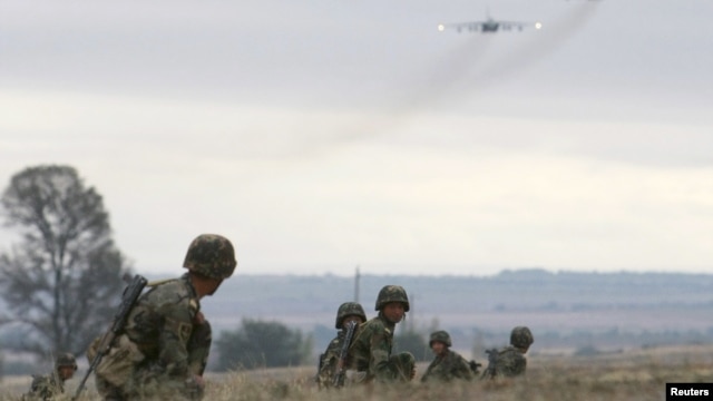 Kyrgyzstan -- Servicemen take part in the Collective Security Treaty Organisation (CSTO) military exercises outside Bishkek, 21Sep2011