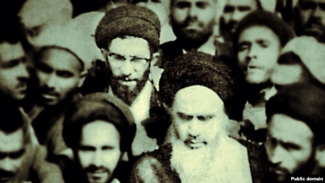 In step with the times? A photo from the "Khamenei.ir" Facebook page shows current Supreme Leader Ali Khamenei (with glasses) behind Islamic Republic of Iran founder Ayatollah Ruhollah Khomeini (front with white beard).