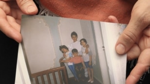 Patimat Suleimanova, aunt of Boston Marathon bombing suspects Dzhokhar and Tamerlan Tsarnaev, holds a photo from the family archive at her house in Makhachkala, 22Apr2013