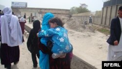 Norouz celebrations included trips to holy shrines, like that of this Afghan woman and her son in Kabul.