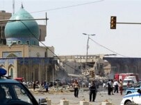 Policemen secure the Baghdad explosion site (AFP)
