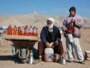 Afghanistan -- A man and his son sell fuel packed in water bottles in the outskirts of Herat city, 24Jan2011