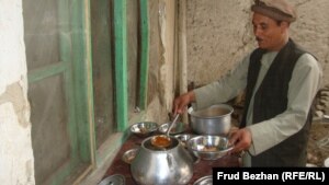 Guests of the campaign meeting are served shurwa, Afghan soup with meat and vegetables that's eaten with bread.