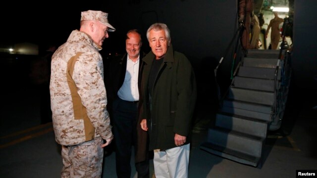 U.S. Secretary of Defense Chuck Hagel (right) is greeted by U.S. Ambassador to Afghanistan James Cunningham (center) and General Joseph Dunford, commander of the International Security Assistance Force upon Hagel's arrival in Kabul on March 8.