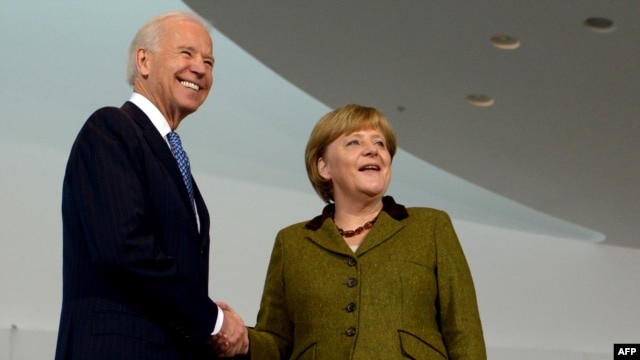 German Chancellor Angela Merkel (right) welcomes U.S. Vice President Joe Biden at the Chancellery in Berlin on February 1.