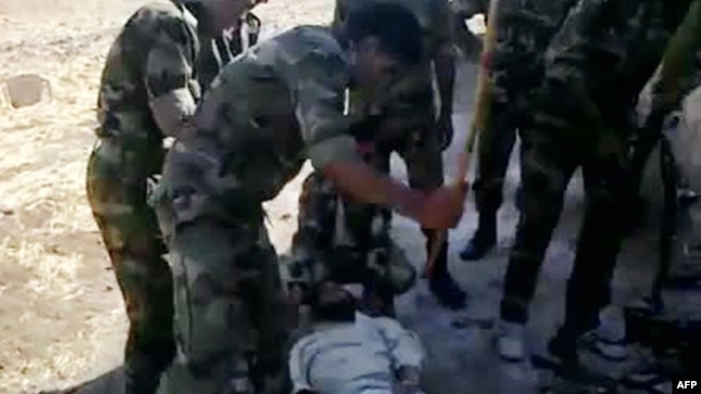 A video shows what is described by antiregime activists as the torture by government forces of a "martyr" named Louai al-Amer in Houla in Homs last year.