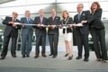 Cutting the ribbon at the grand opening ceremony.