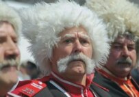 Cossacks attending the unveiling of a monument to their tsarist-era predecessors in the Kuban region of Krasnodar Krai in April (TASS)