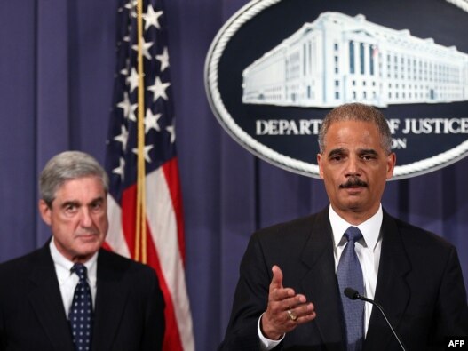 U.S. Attorney General Eric Holder (right) and FBI Director Robert Mueller divulge details of an alleged Iranian plot to kill the Saudi ambassador to the United States and bomb the embassies of Saudi Arabia and Israel in Washington. 