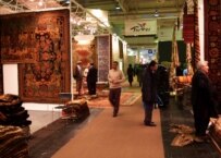 Customers and dealers meet at the Domotex trade fair in Hannover (RFE/RL)