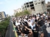 Musavi, Mourners March En Masse