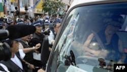 Japanese police with their hands full in Sapporo on July 5