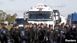 French police secure the entrance to a petrol depot in Fos sur Mer, near Marseille, on October 20.