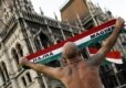 A protester outside the Hungarian parliament makes clear his nationalist credentials with a tattooed map of Hungary on his back (AFP)