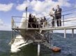 Danish Economy Minister Bendt Bendtsen (right) unveils a model of a cutting-edge wave-energy generator in August (epa)