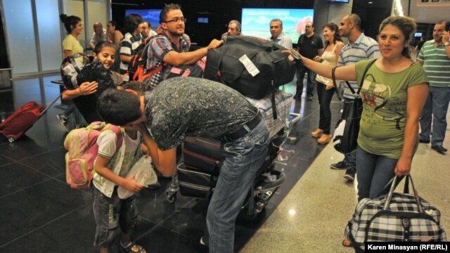 Armenia -- Syrian Armenians arrive in Yerevan, 17Aug2012.