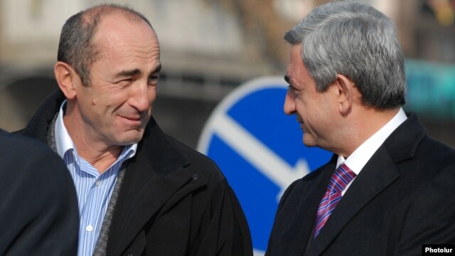 Armenia - President Serzh Sarkisian (R) and his predecessor Robert Kocharian at an official ceremony near Yerevan, 3Dec2008.
