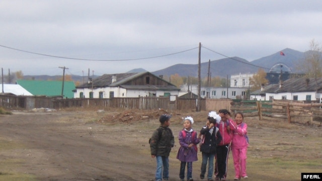 Mongolian children walk home from school in Zuunkharaa, a former railroad and industrial hub 160 kilometers from the capital, Ulan Bator.