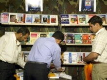 Iran - Visitors stop at the stand of Lebanon's Hezbollah group at Iran's international book fair in Tehran, 07May2005