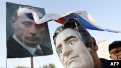 Bosnian Serb man wears a mask in the likeness of war crimes indictee Radovan Karadzic during a protest in Banja Luka in September