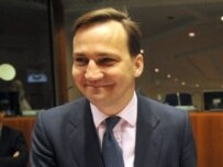 Poland Foreign Minister Radoslaw Sikorski is all smiles after tabling his Eastern Partnership initiative in Brussels on May 26 (AFP)