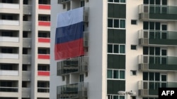 A Russian flag is displayed at the Olympic village for athletes in Rio de Janeiro.