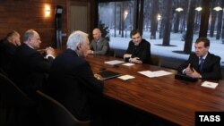 Russian President Dmitry Medvedev (right) meets with leaders of parliamentary political parties at the Gorki presidential residence on December 13.