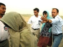 Two South Korean women are escorted after being released by the Taliban on August 13 (AFP)