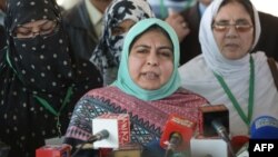 Amina Masood Janjua, chairwoman of Defense Of Human Rights Pakistan, and family members of the missing address the press outside the Supreme Court building after a hearing in Islamabad on December 6.