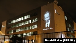 Czech Republic – The image of Vaclav Havel is projected on the front of the RFE/RL building in Prague, 21Dec2011