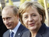 Putin (left) and Merkel highlighted economic ties (AFP)