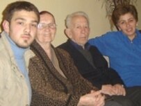 Gezim Latifi with his family in Pristina (RFE/RL)
