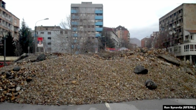 Barricades erected by Serbs on the north side of the central bridge in Mitrovica prevent cars from crossing.
