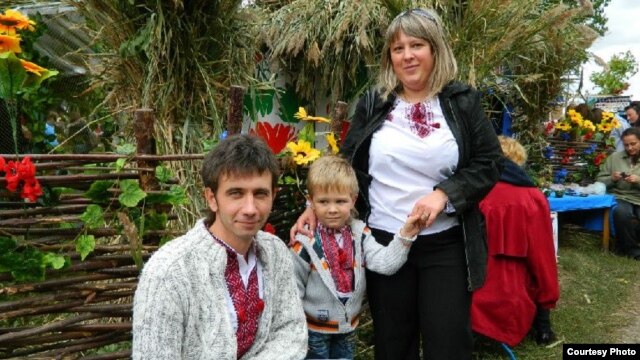 Kharkiv resident Irina Toldina with her husband, Oleg, and their son, Yaroslav. Toldina says life in Ukraine was "unequivocally" better under Tymoshenko.