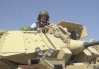 RFE/RL's Ron Synovitz in an APC in Iraq, March 2003 (RFE/RL)