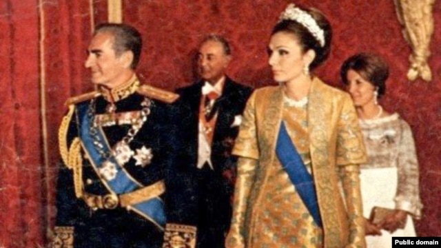 The last shah of Iran, Mohammad Reza Pahlavi (left), with his wife, Farah Pahlavi, in a royal ceremony (undated).