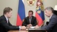 Russian President Dmitry Medvedev is flanked by Gazprom CEO Aleksei Miller (left) and Ukrainian Energy Minister Yuriy Boiko during a meeting in August.
