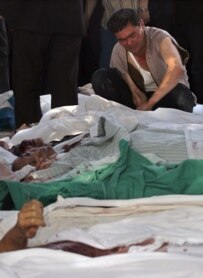 A man tries to identify a relative among Andijon's dead in May 2005 (epa)