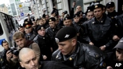 Russian police detain opposition leader Sergei Udaltsov during a rally in Moscow in September.