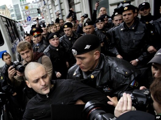 Russian police detain opposition leader Sergei Udaltsov during a rally in Moscow in September.