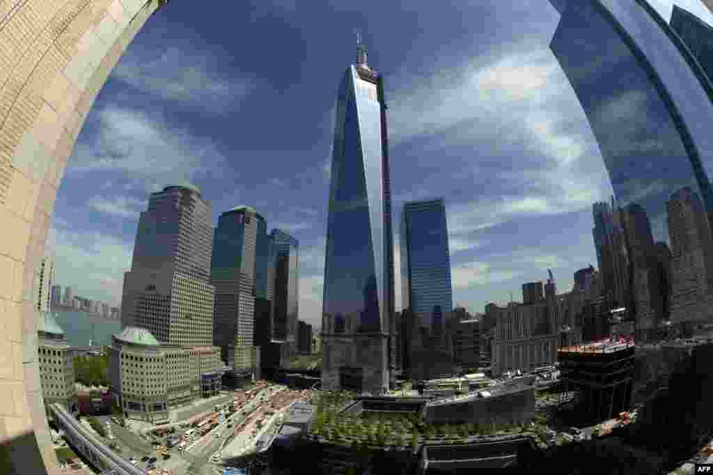 The final section of the spire sits on top of One World Trade Center in New York after it was fully installed on the building's roof. With the spire now in place, One WTC stands 541 meters high, making it the tallest building in the Western Hemisphere. (AFP/Timothy A. Clary)
