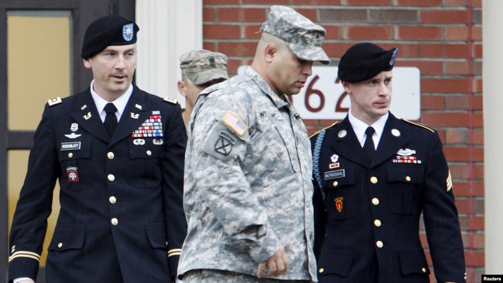 U.S. Army Sergeant Bowe Bergdahl (right) leaves a courthouse after an arraignment hearing for his court-martial in Fort Bragg, North Carolina, in December 2015.